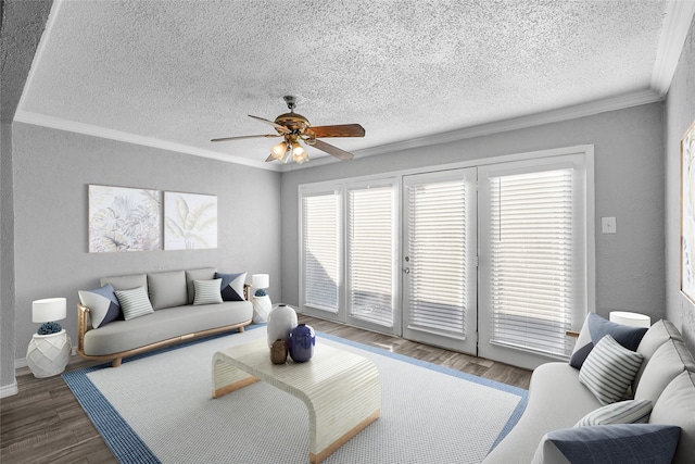 living room with crown molding, dark wood-type flooring, and a wealth of natural light