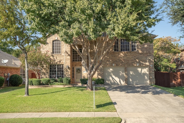 view of front facade with a garage and a front lawn