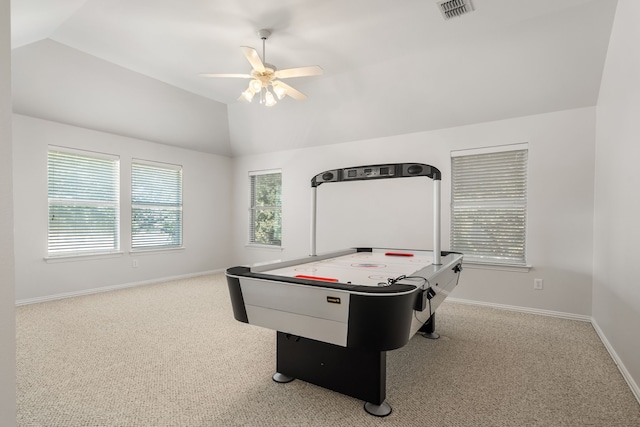 recreation room with light carpet, vaulted ceiling, and ceiling fan