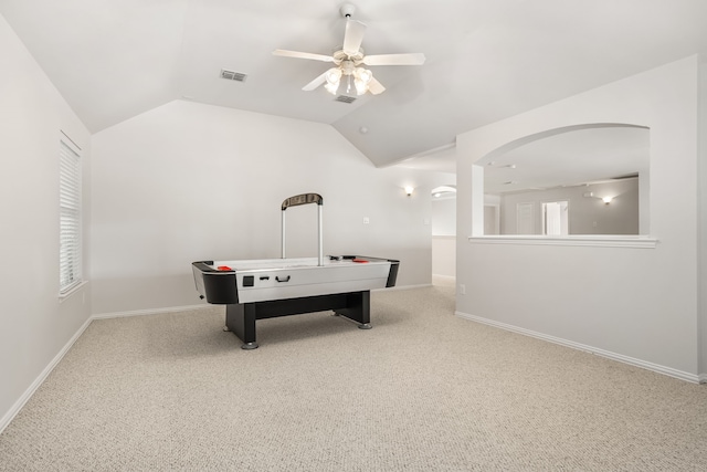 game room featuring ceiling fan, light colored carpet, and vaulted ceiling