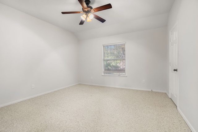 carpeted empty room featuring lofted ceiling and ceiling fan