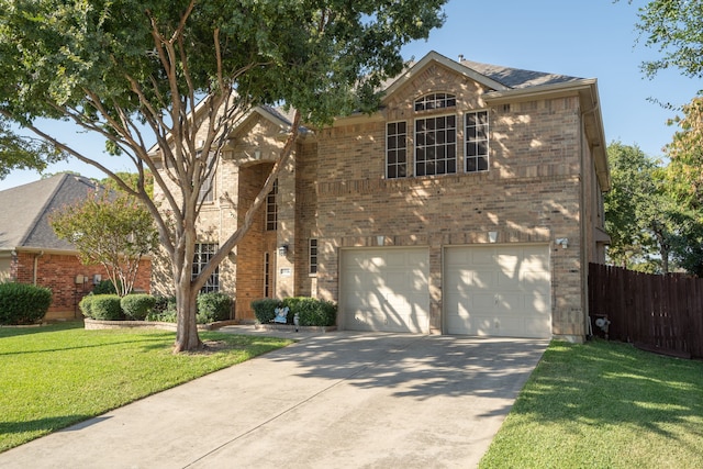 view of front property with a front yard and a garage