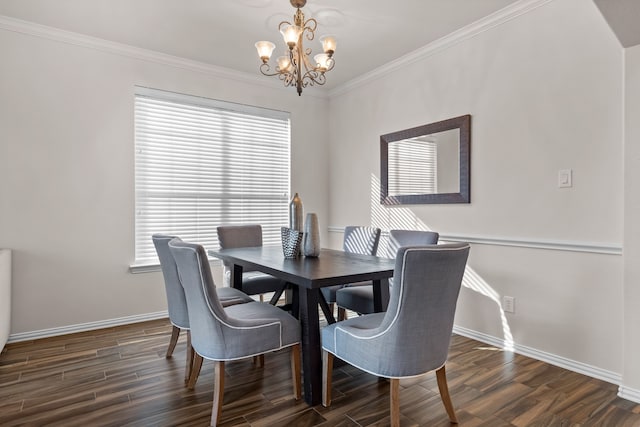 dining room with ornamental molding, dark wood-type flooring, and an inviting chandelier