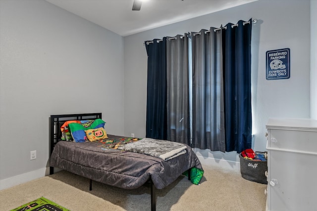 bedroom featuring ceiling fan and carpet floors