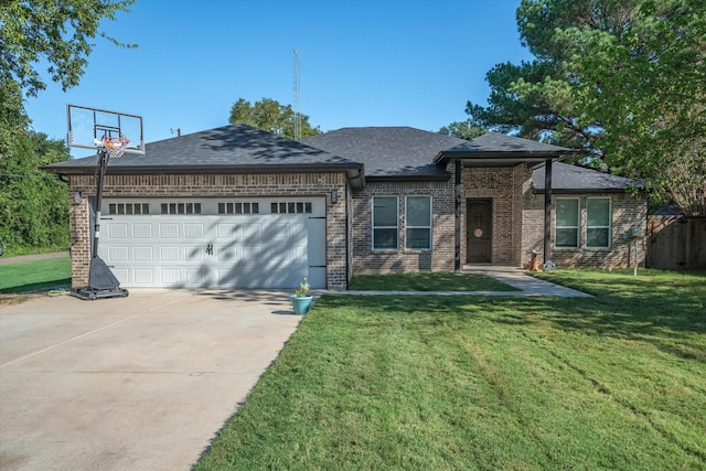 view of front of home with a front lawn and a garage