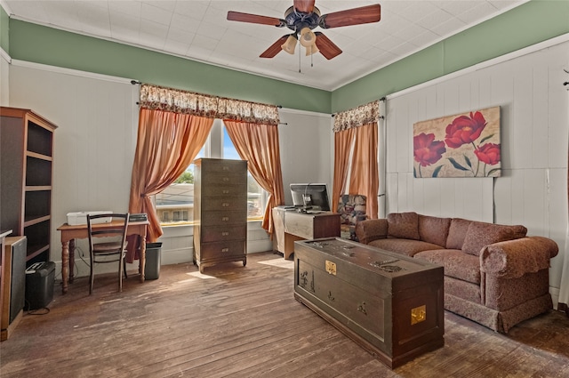 living room with ceiling fan and dark wood-type flooring