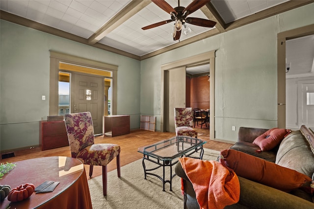 living room with light wood-type flooring, beam ceiling, and ceiling fan