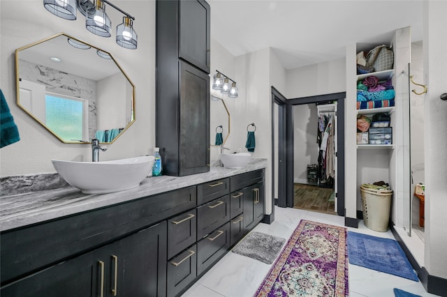 bathroom featuring vanity, a shower with shower door, and wood-type flooring