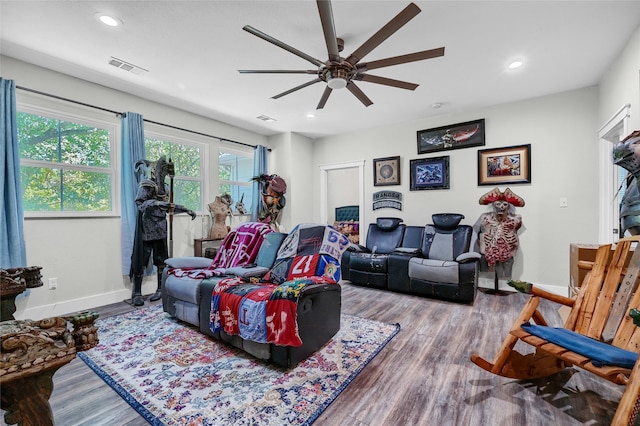 living room featuring hardwood / wood-style flooring and ceiling fan