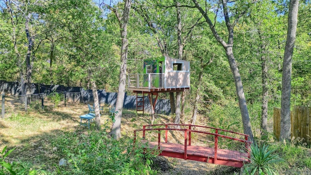 view of playground with a wooden deck