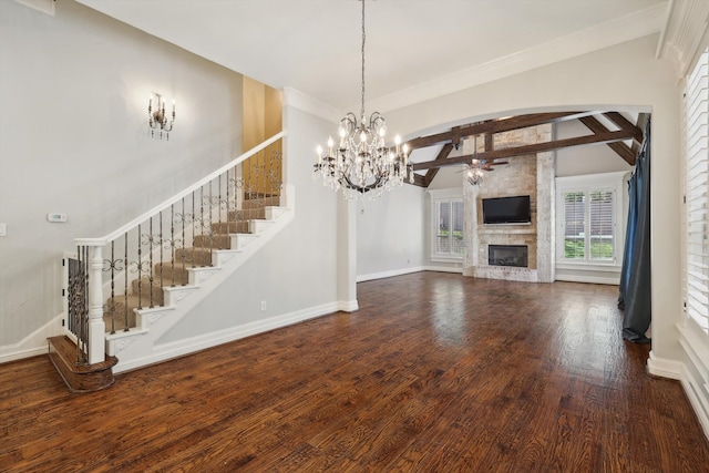 unfurnished living room with a chandelier, a fireplace, lofted ceiling with beams, and hardwood / wood-style flooring