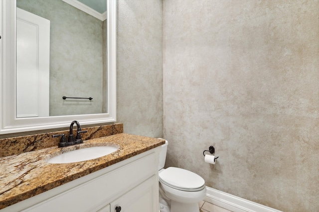 bathroom with crown molding, tile patterned flooring, vanity, and toilet