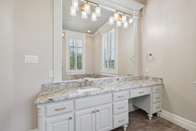 bathroom featuring crown molding and vanity