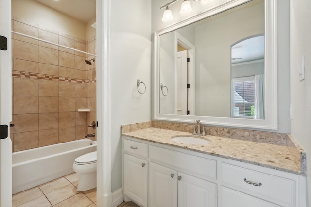 full bathroom with vanity, tile patterned floors, tiled shower / bath combo, and toilet