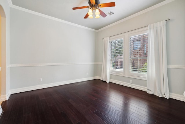 empty room featuring ceiling fan, dark hardwood / wood-style flooring, and crown molding