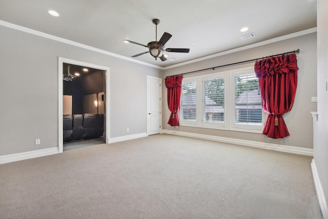 unfurnished room with crown molding, ceiling fan, and light colored carpet