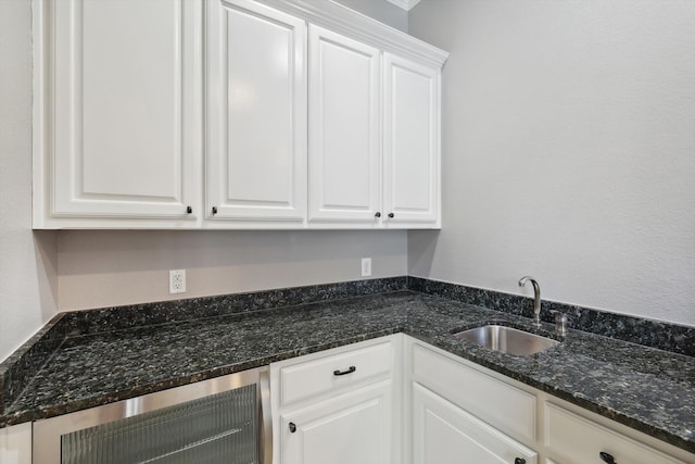 clothes washing area with sink and beverage cooler