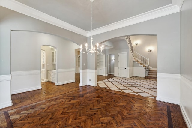 unfurnished dining area with dark parquet floors and ornamental molding