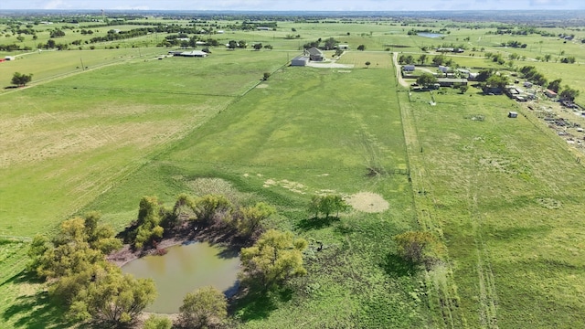 birds eye view of property with a water view and a rural view