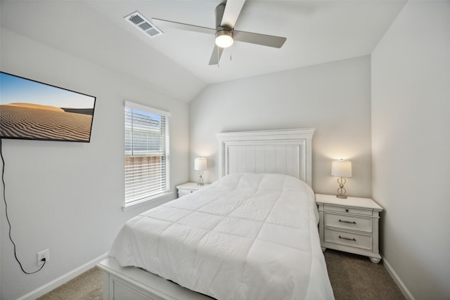 bedroom featuring ceiling fan, vaulted ceiling, and dark carpet