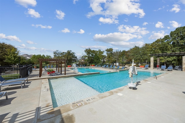 view of pool with a pergola and a patio