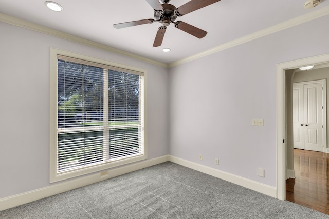 empty room featuring ornamental molding, ceiling fan, and carpet flooring