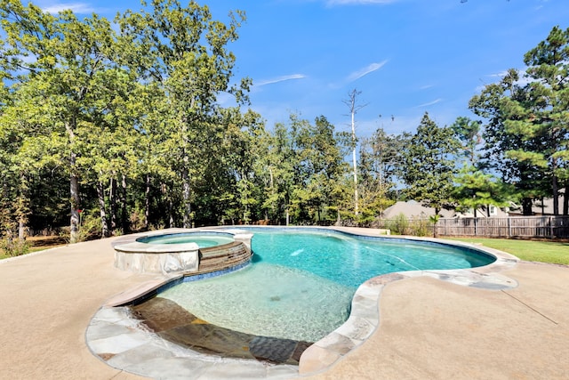 view of pool with a patio and an in ground hot tub