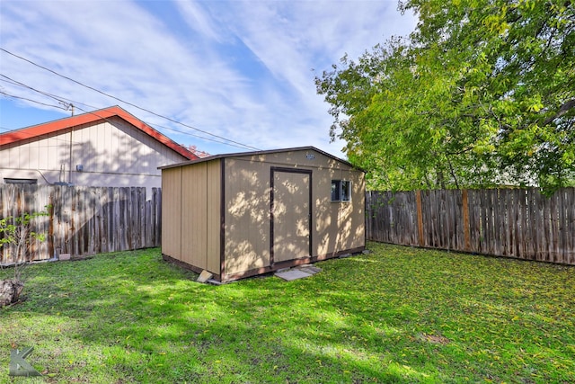 view of outdoor structure featuring a lawn