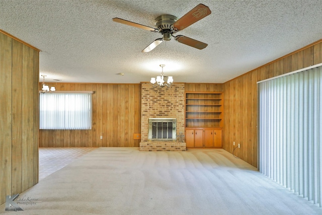 unfurnished living room featuring light carpet and wooden walls