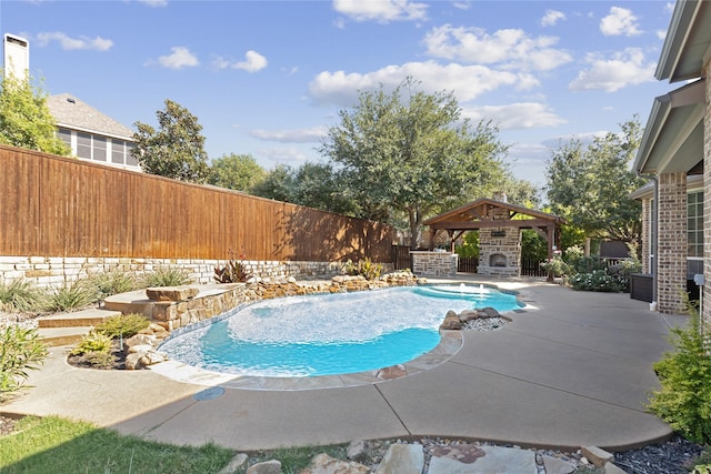 view of pool featuring a gazebo, a patio, and an outdoor fireplace