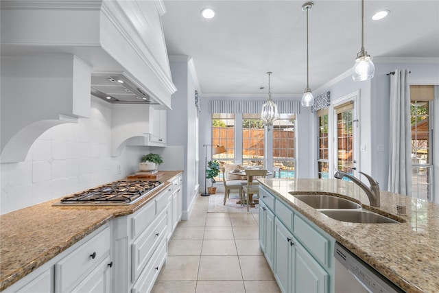 kitchen featuring dishwashing machine, sink, white cabinetry, and stainless steel gas cooktop