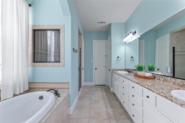 bathroom featuring vanity, tile patterned floors, and separate shower and tub