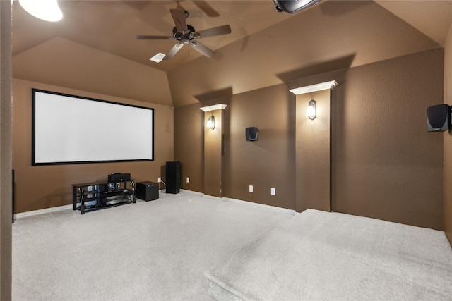 home theater with lofted ceiling, carpet, and ceiling fan