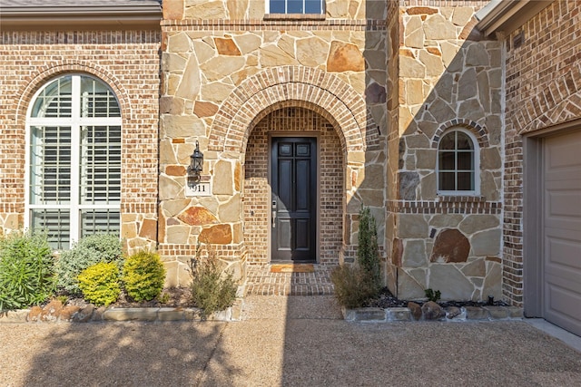 doorway to property featuring a garage