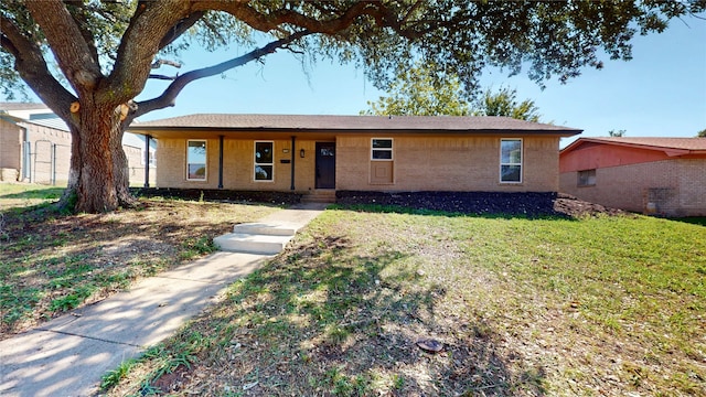 ranch-style house with a front lawn