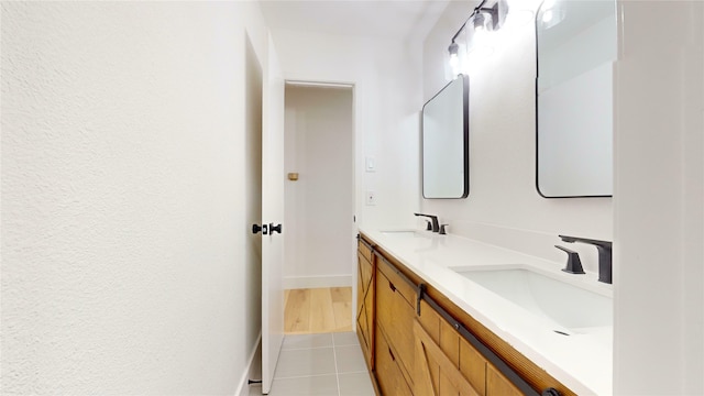 bathroom featuring tile patterned flooring and vanity