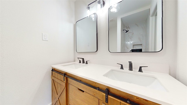 bathroom featuring walk in shower and vanity