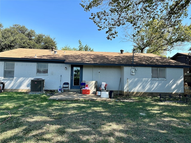 back of property featuring a patio, central air condition unit, and a yard