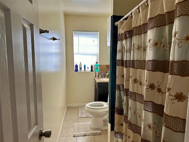 bathroom with tile patterned floors, a shower with curtain, vanity, and toilet