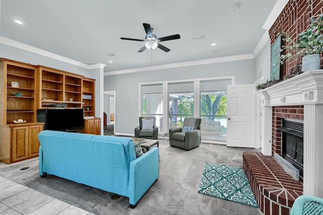 living room featuring ceiling fan, a fireplace, light colored carpet, and crown molding