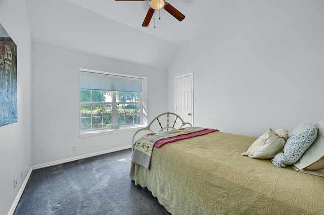 carpeted bedroom featuring vaulted ceiling and ceiling fan