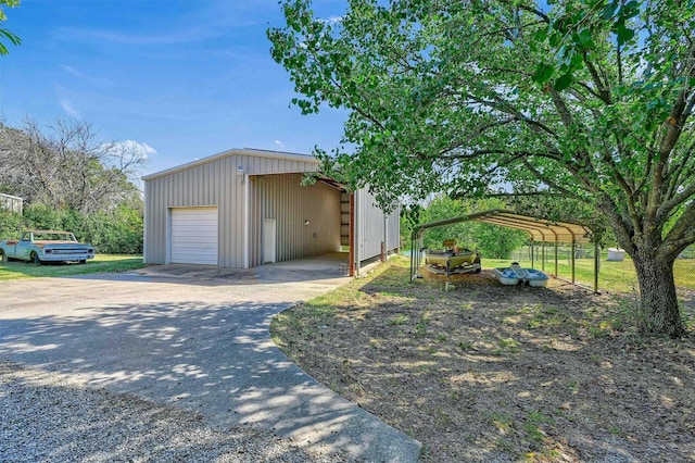 garage featuring a carport