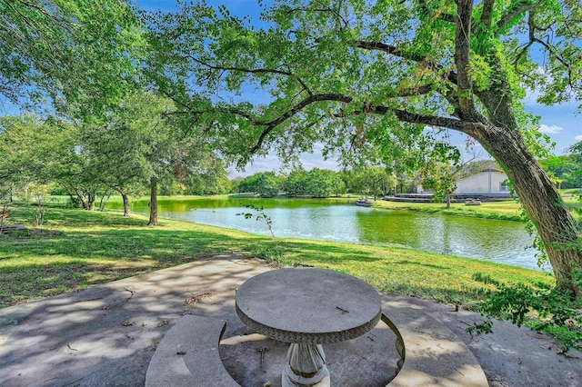 view of patio with a water view