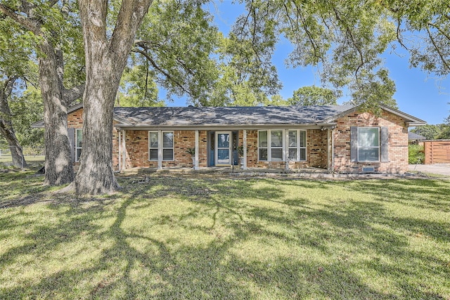 ranch-style home with a front lawn