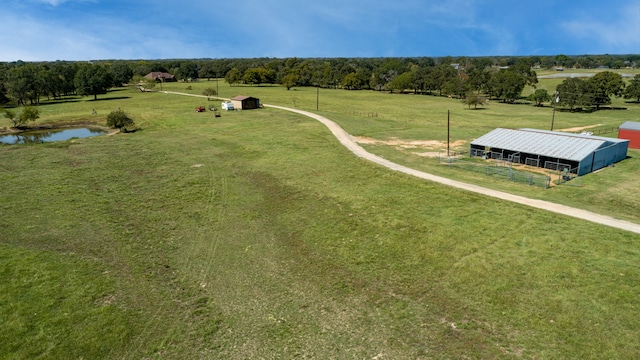 bird's eye view with a rural view and a water view