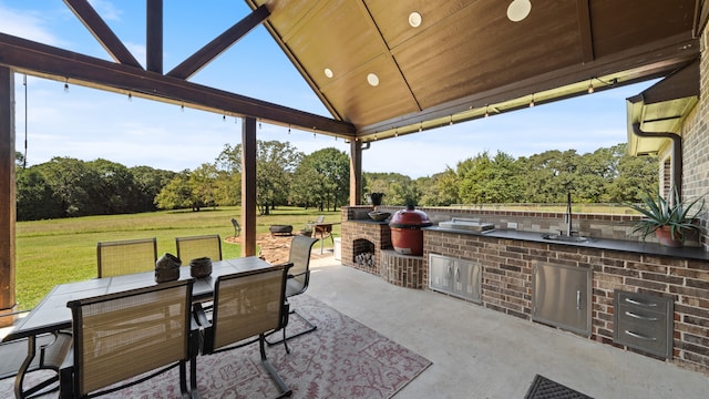 view of patio / terrace featuring a gazebo and exterior kitchen