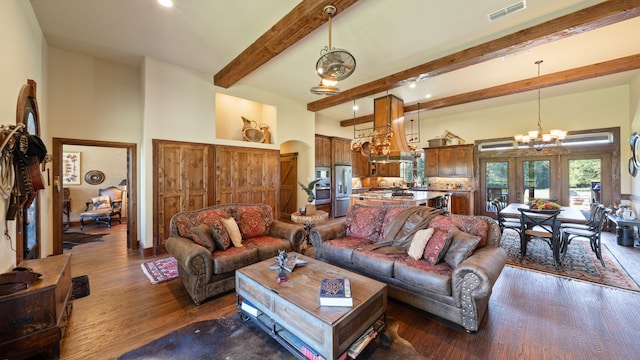 living room with beamed ceiling, dark hardwood / wood-style flooring, and an inviting chandelier