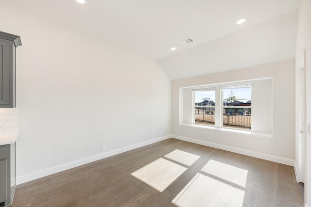 interior space featuring vaulted ceiling and hardwood / wood-style floors