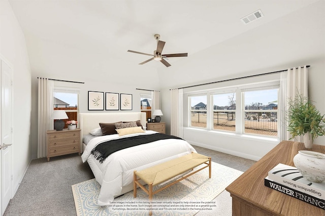 carpeted bedroom with ceiling fan and lofted ceiling