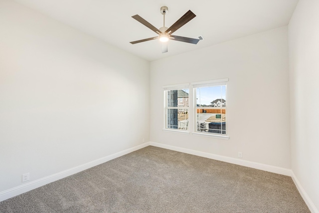 spare room featuring ceiling fan and carpet flooring